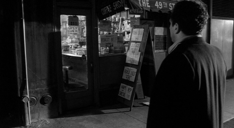 a man standing in front of a vending machine