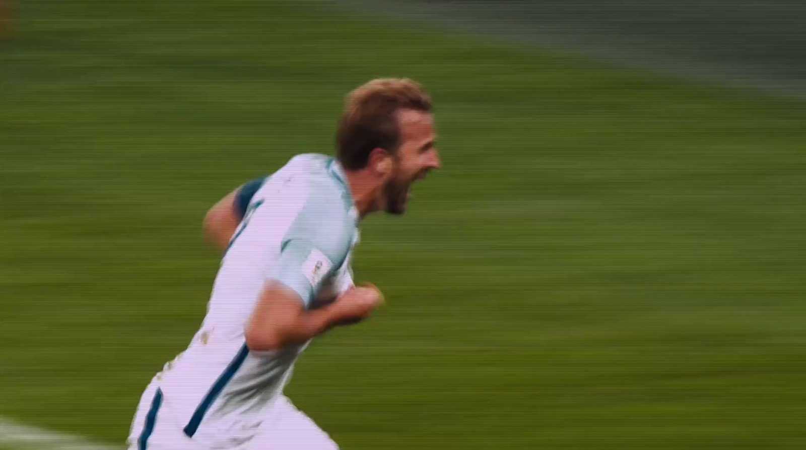 a man with a beard running on a soccer field