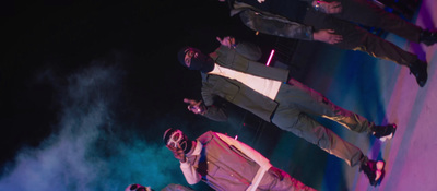 a group of men standing on top of a stage