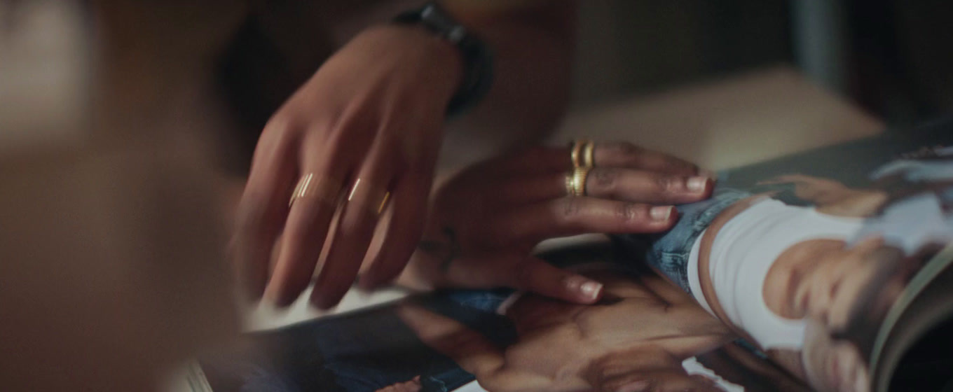 a close up of a person putting a ring on another person's finger