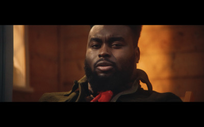 a man with a beard wearing a red tie