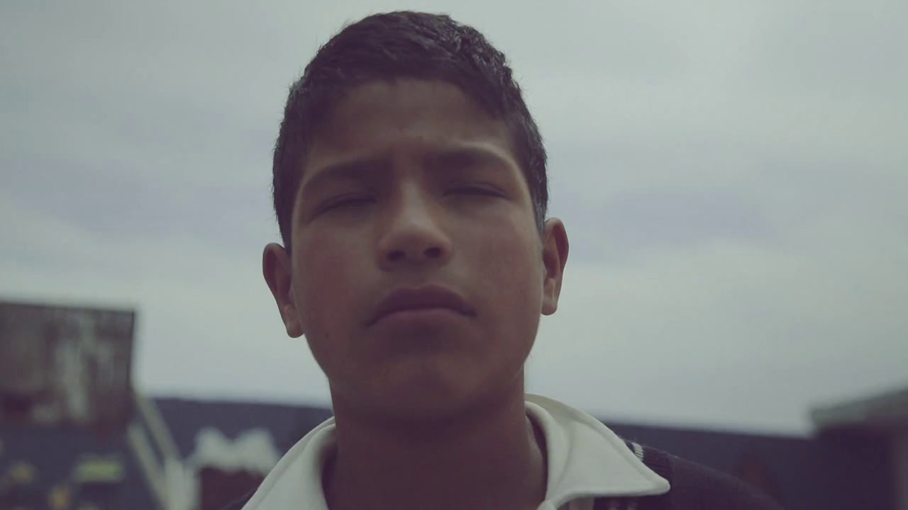 a close up of a person wearing a white shirt