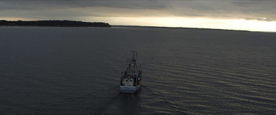 a large boat floating on top of a large body of water