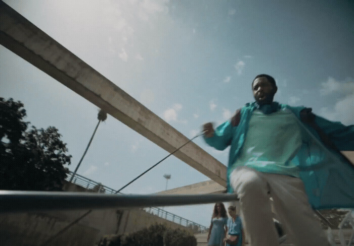 a man riding a skateboard down a metal rail