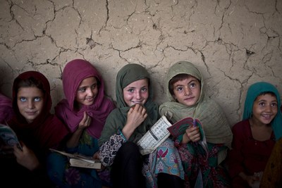 a group of women sitting next to each other