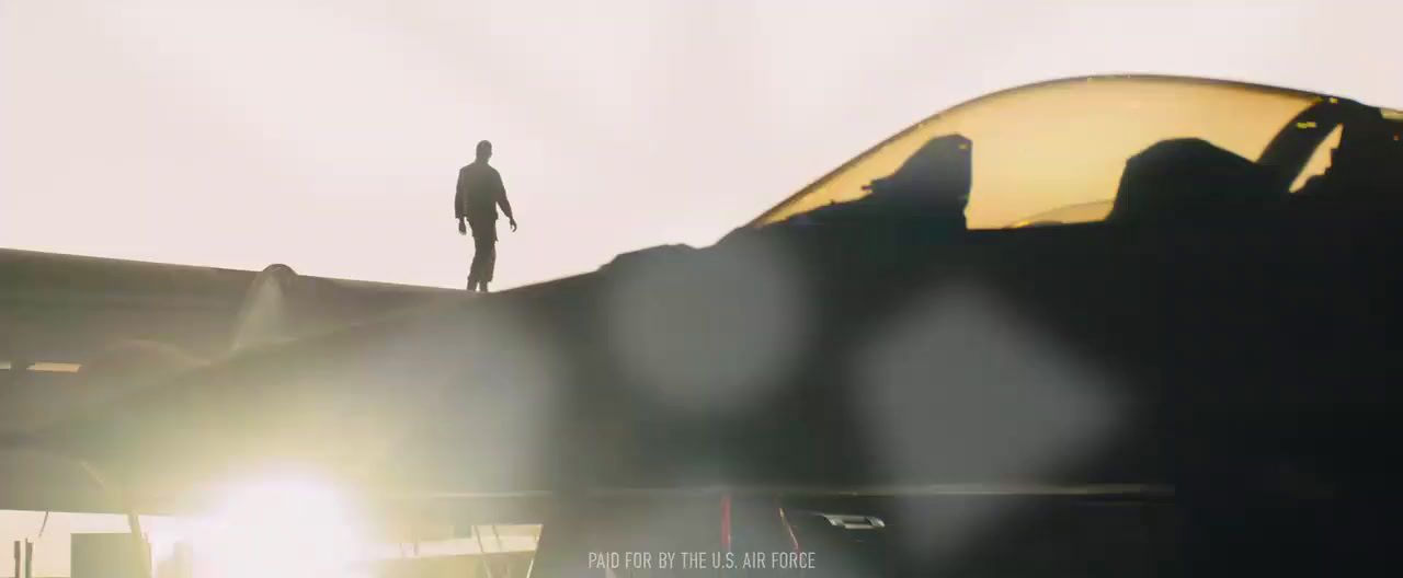 a man standing on top of an airplane