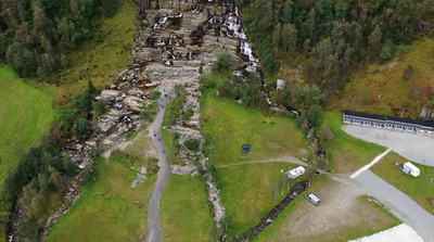 an aerial view of a rocky area in the woods