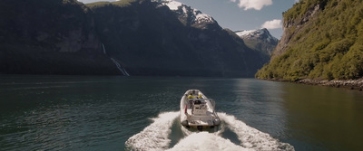 a motor boat traveling through a large body of water