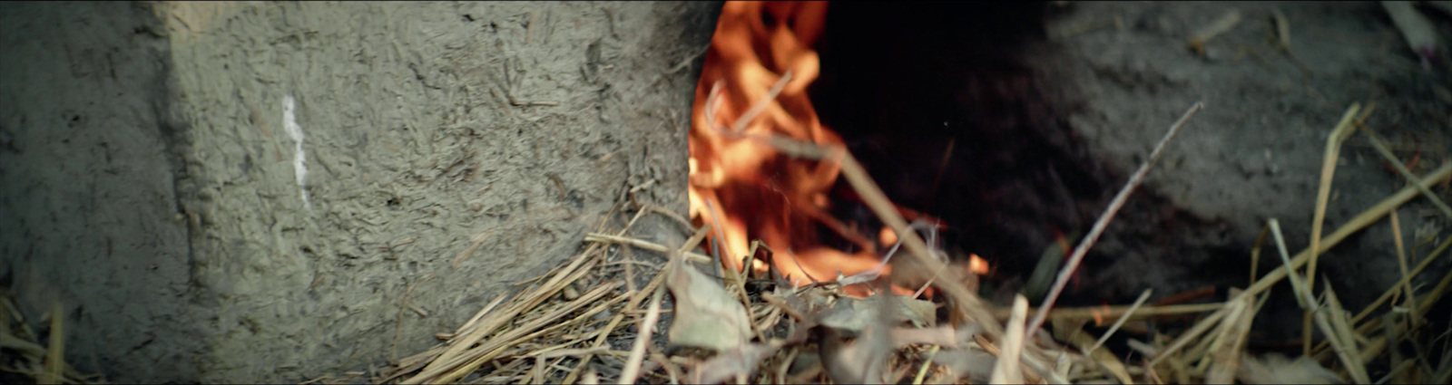 a close up of a fire in a stone wall