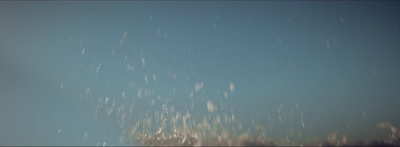 a snowboarder in the air on a clear day