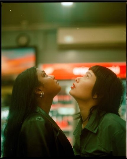 a couple of women standing next to each other