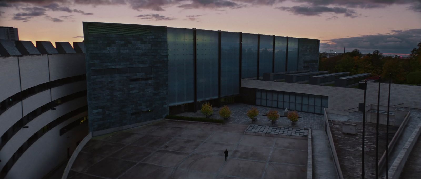 an aerial view of a building at dusk