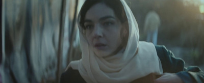 a woman with a white scarf around her head