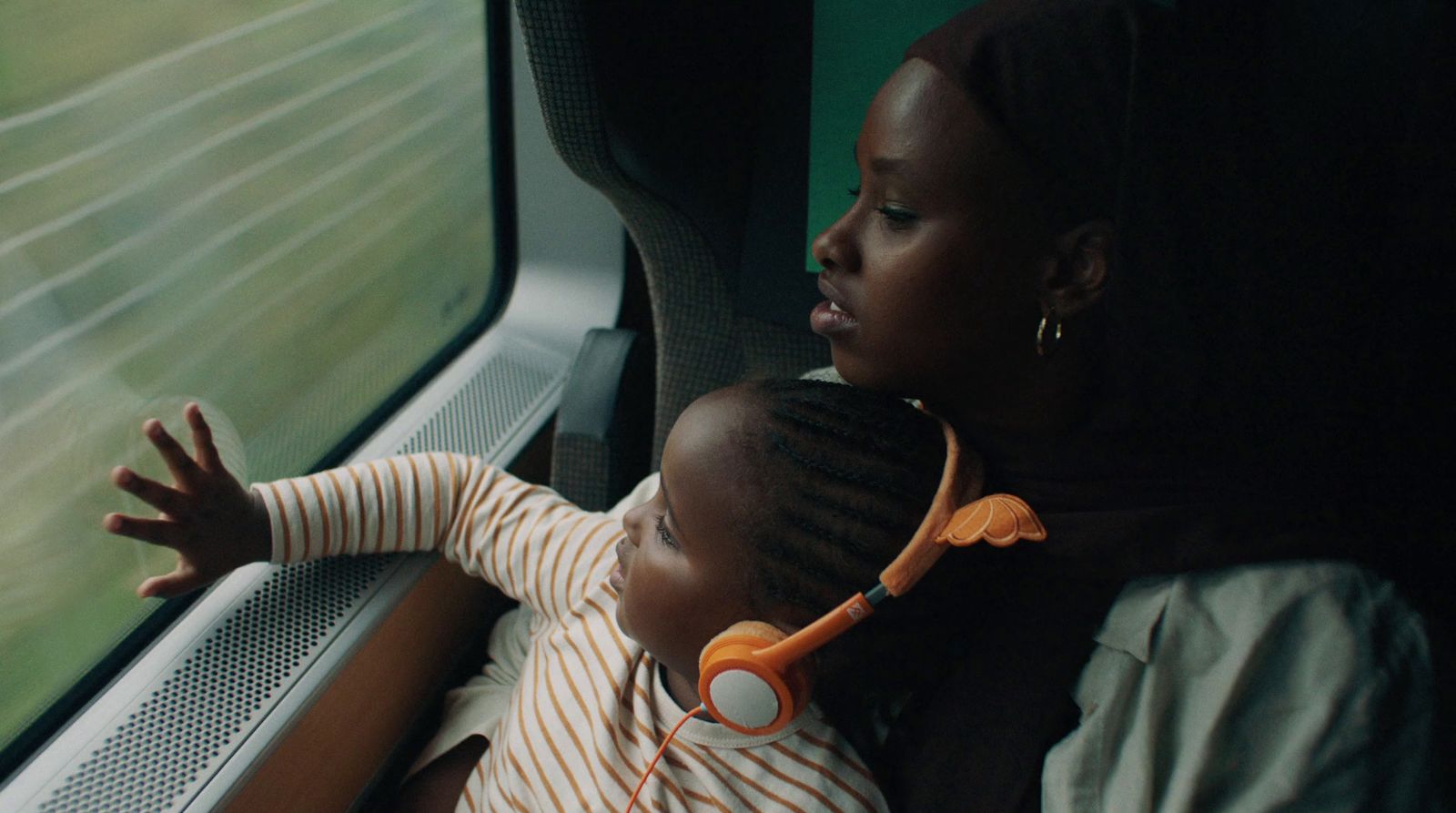 a woman and a child on a train