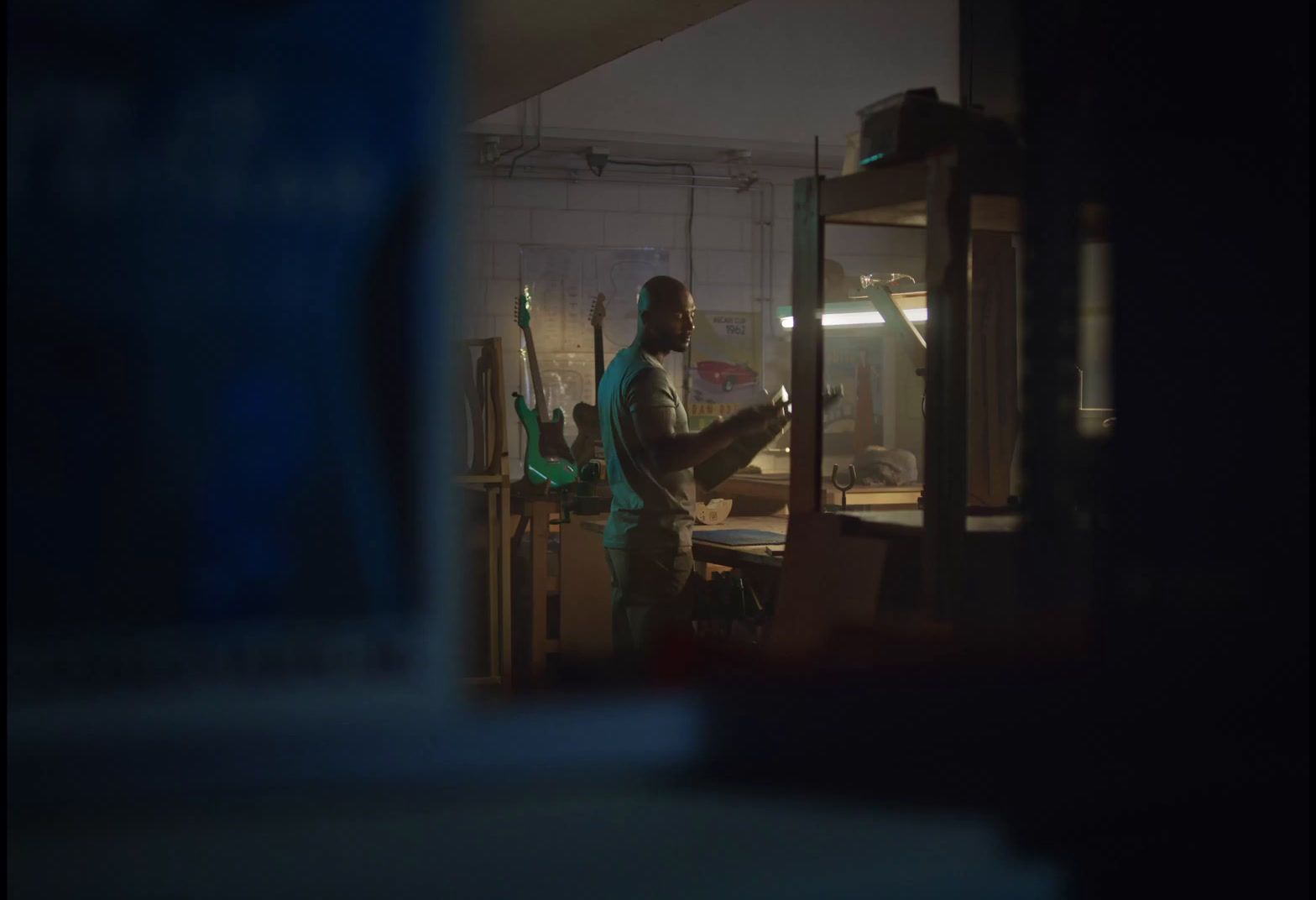 a man standing in a room with tools