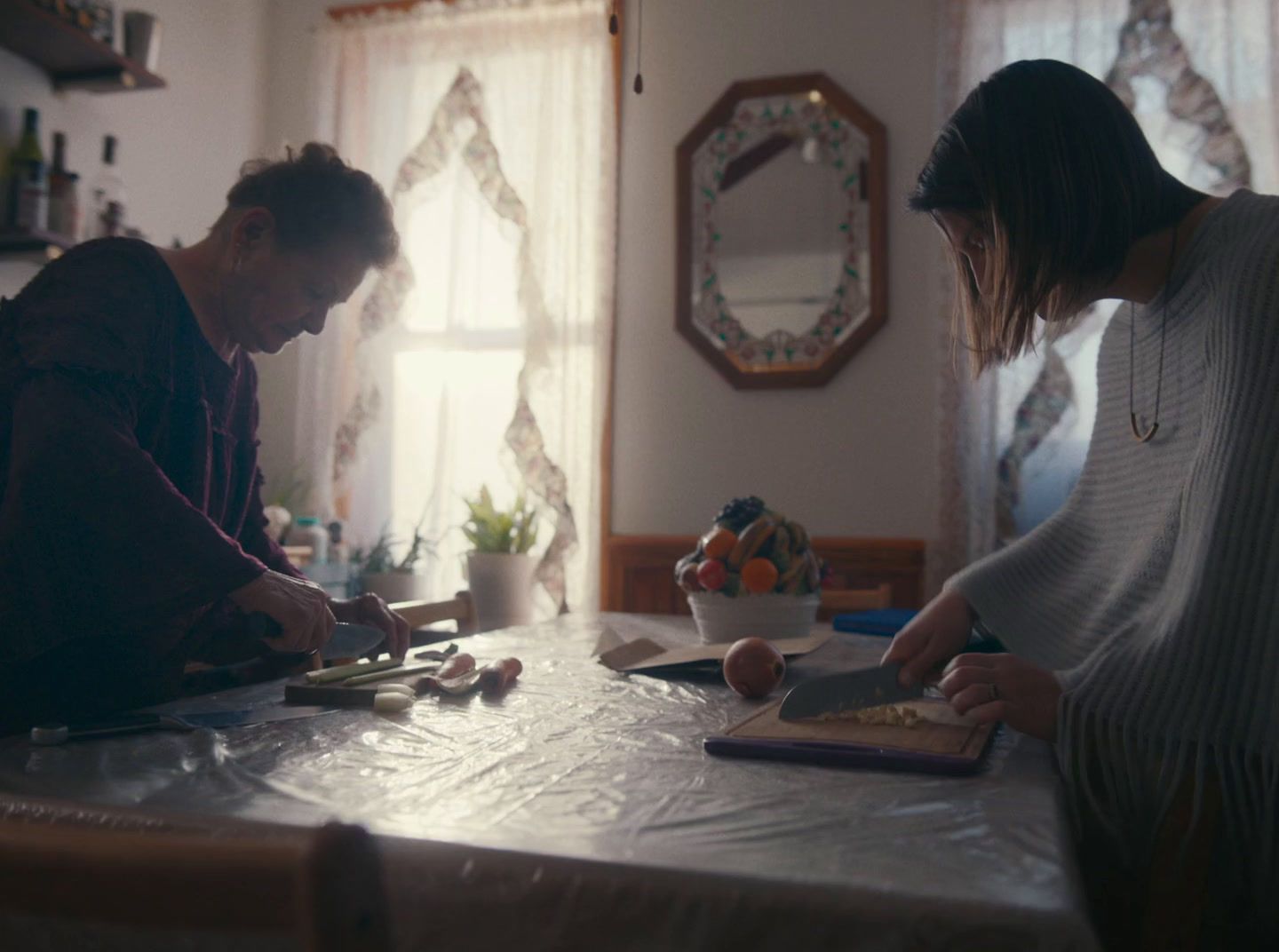 a couple of people that are standing in front of a table