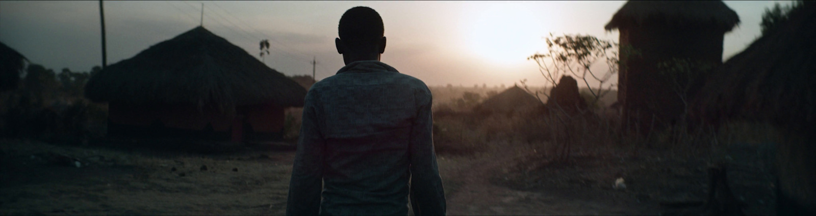 a man standing in the middle of a field