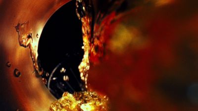 a close up of a metal object with water droplets