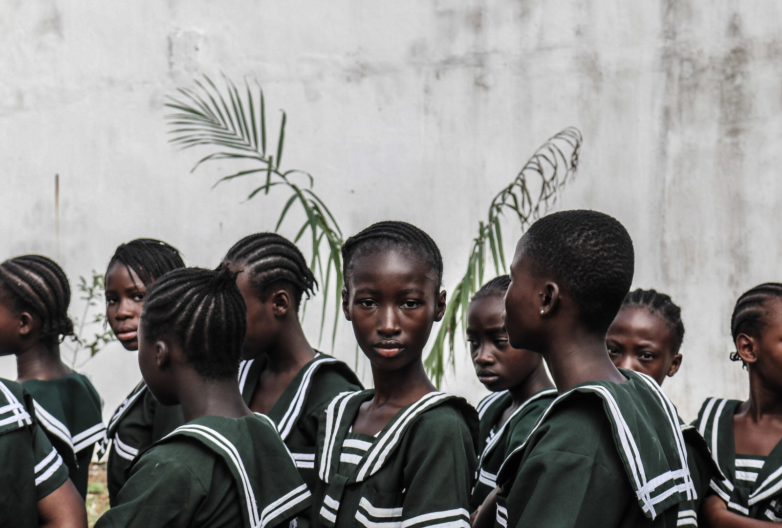 a group of young girls standing next to each other