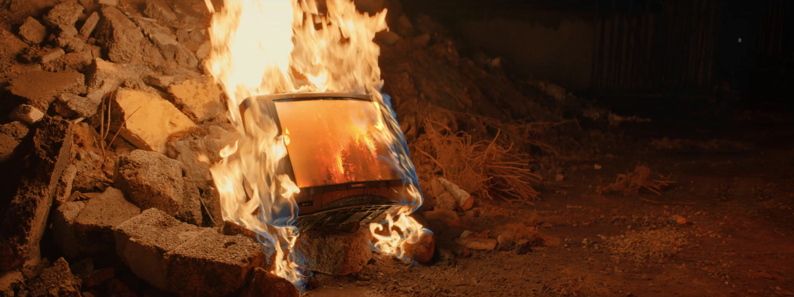 a fire burning inside of a brick oven