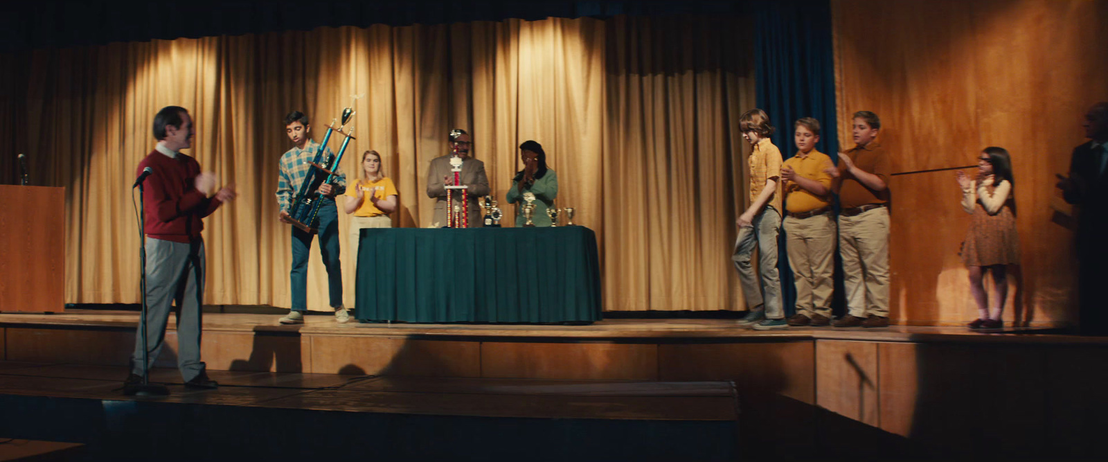 a group of people standing on top of a stage