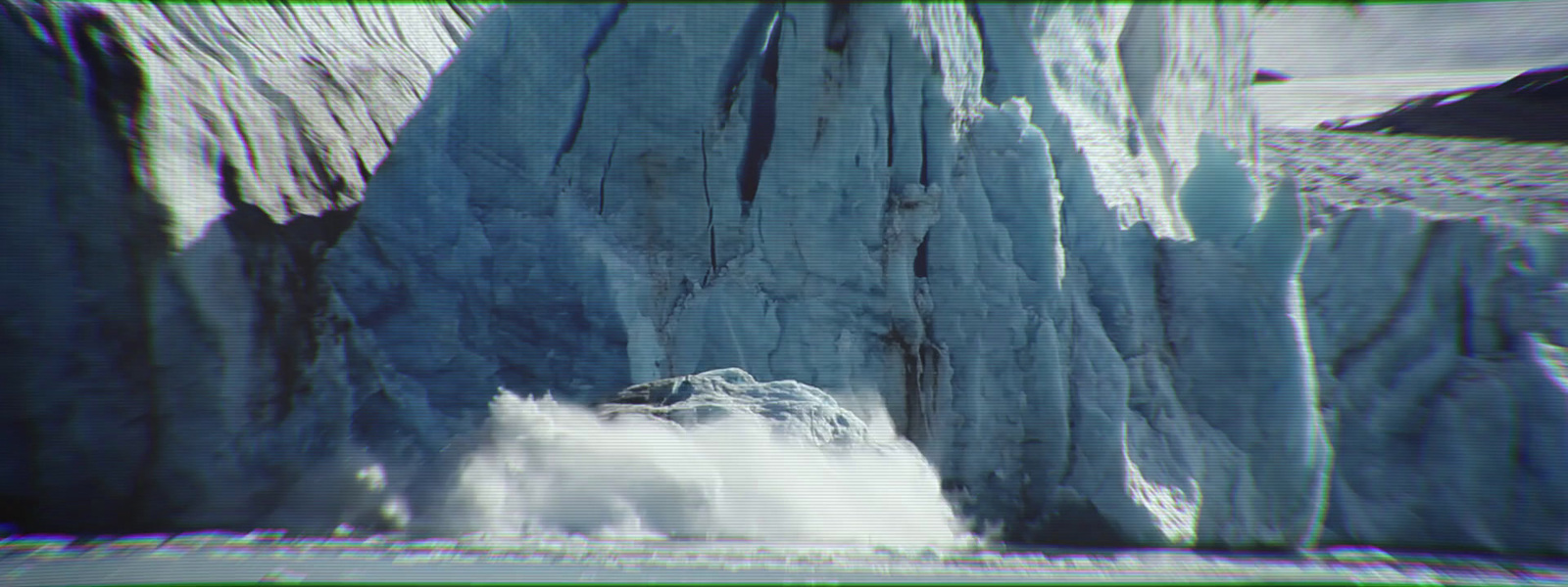 a very large iceberg in the middle of the ocean