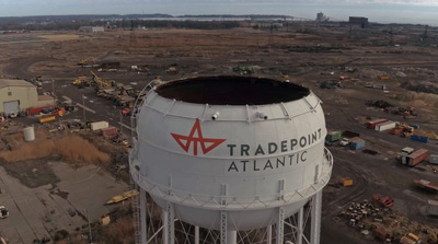 a large white water tower with a red star on it