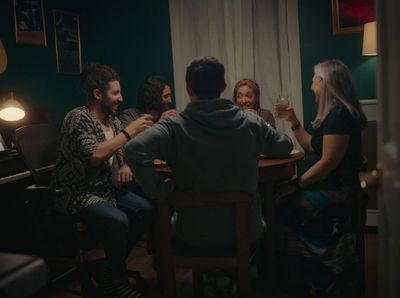 a group of people sitting around a table