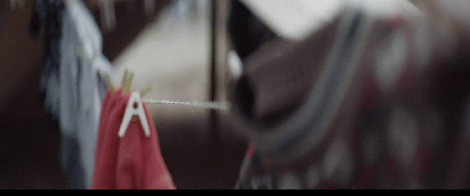 a close up of clothes hanging on a clothes line