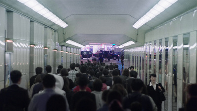 a group of people walking down a hallway