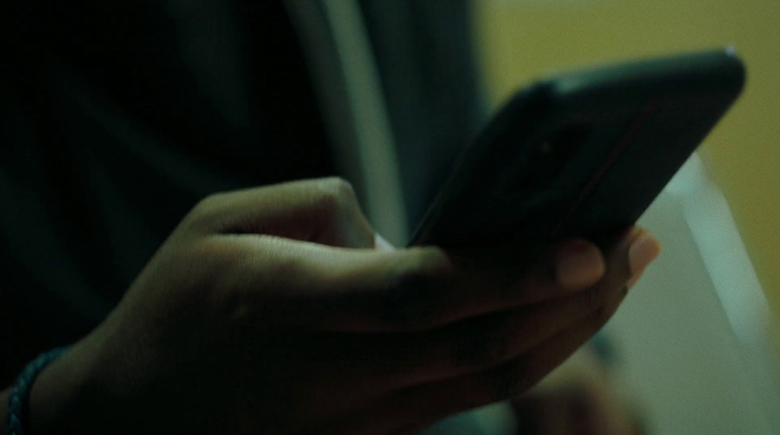 a close up of a person holding a cell phone