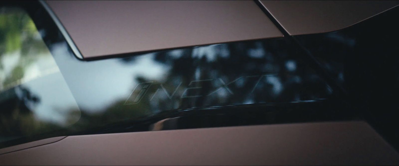 a close up of a car with trees in the background