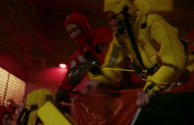 a group of people dressed in yellow and red