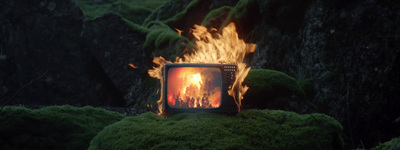 a television sitting on top of a lush green field