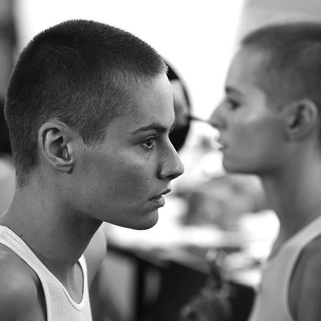 two young men standing next to each other