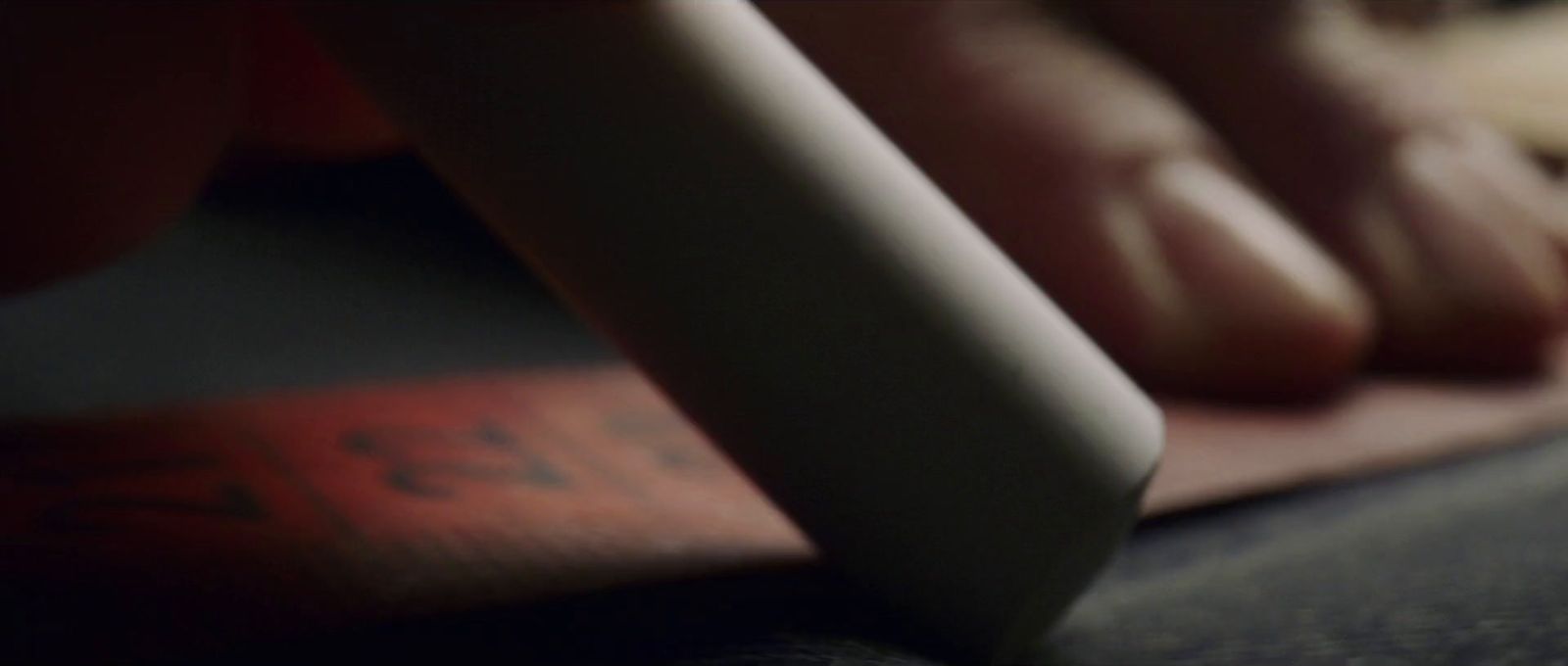 a close up of a person's feet with a book in the background