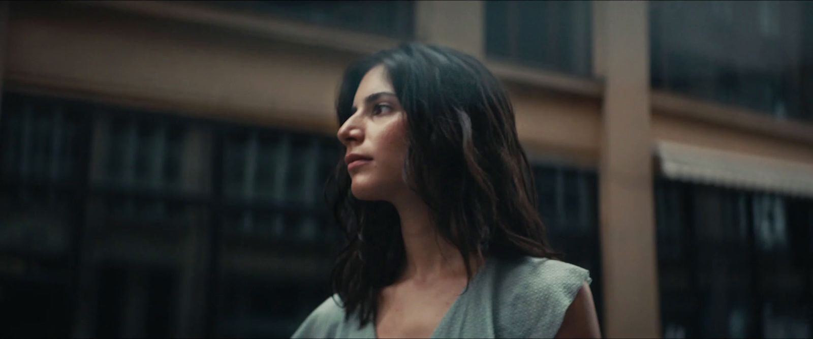 a woman standing in front of a building