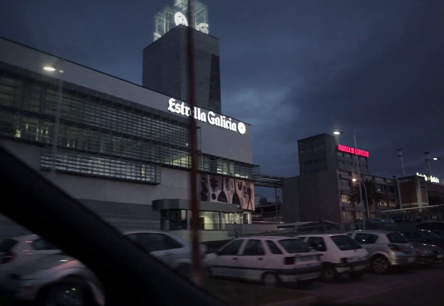 a large building with a clock tower at night