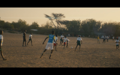 a group of young men playing a game of soccer