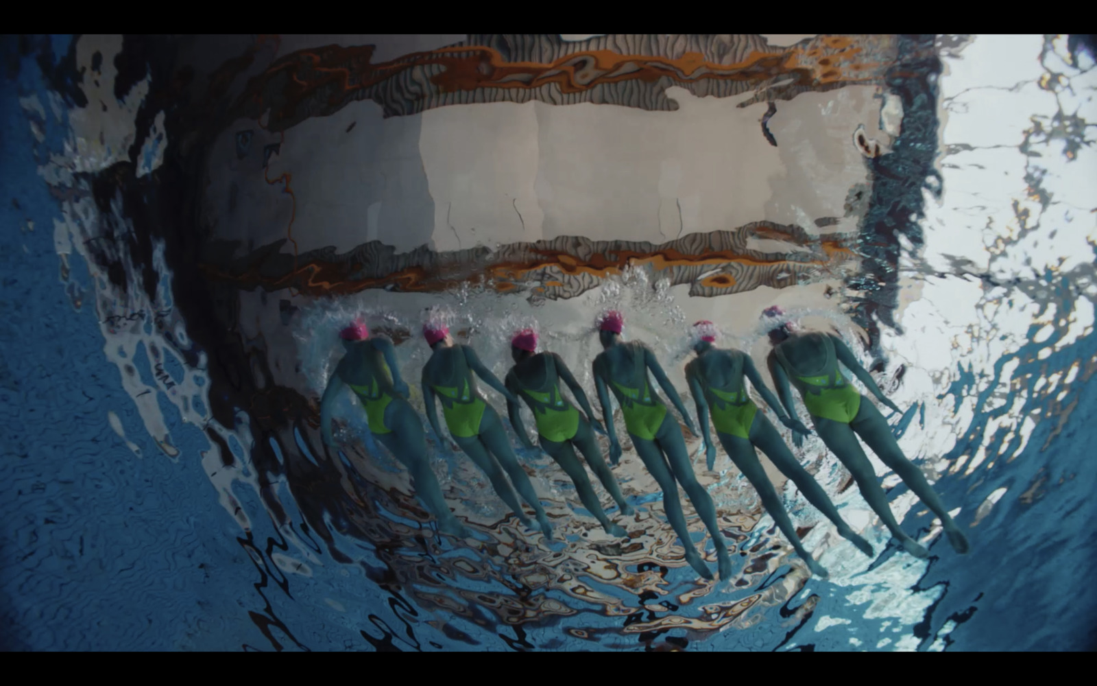 a close up of a group of toothbrushes in the water