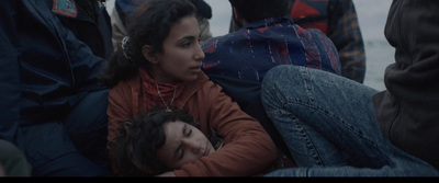 a woman is laying on the ground with her head in her hands