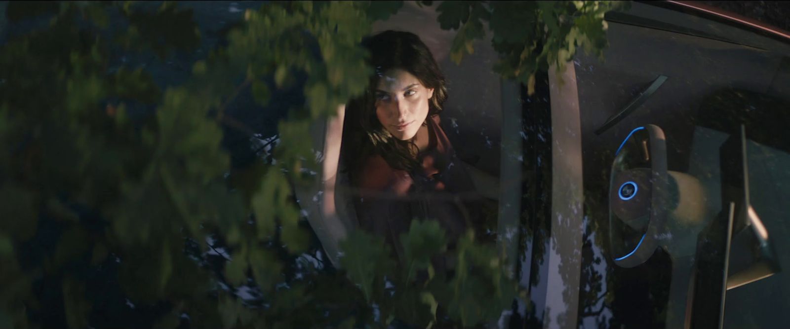 a woman looking out the window of a car