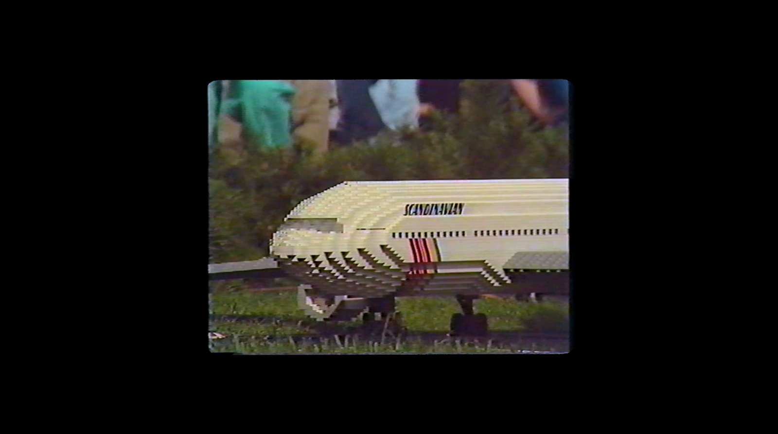 a model of a passenger jet sitting on the ground