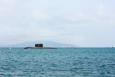 a submarine floating on top of a large body of water