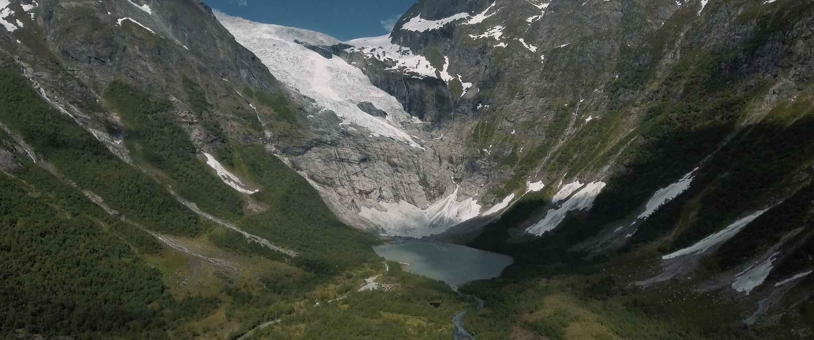 an aerial view of a glacier in the mountains