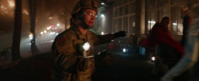 a man in a military uniform holding a flashlight