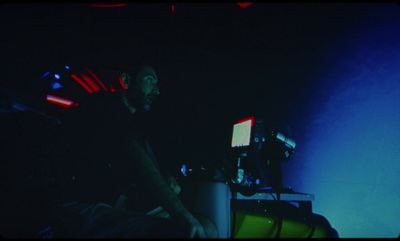 a man sitting in front of a laptop computer