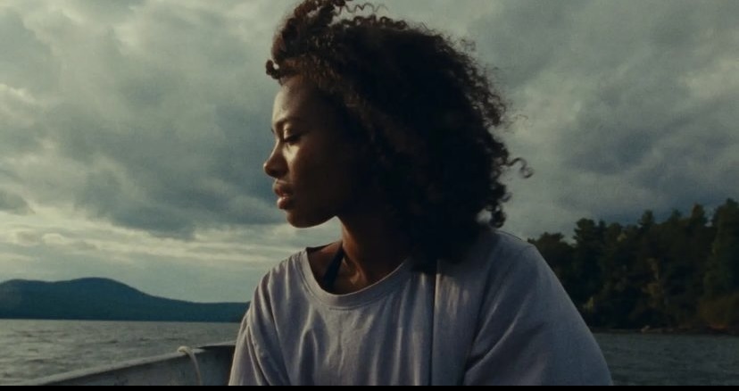 a woman sitting on a boat in the water