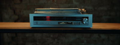 a stereo sitting on top of a wooden table