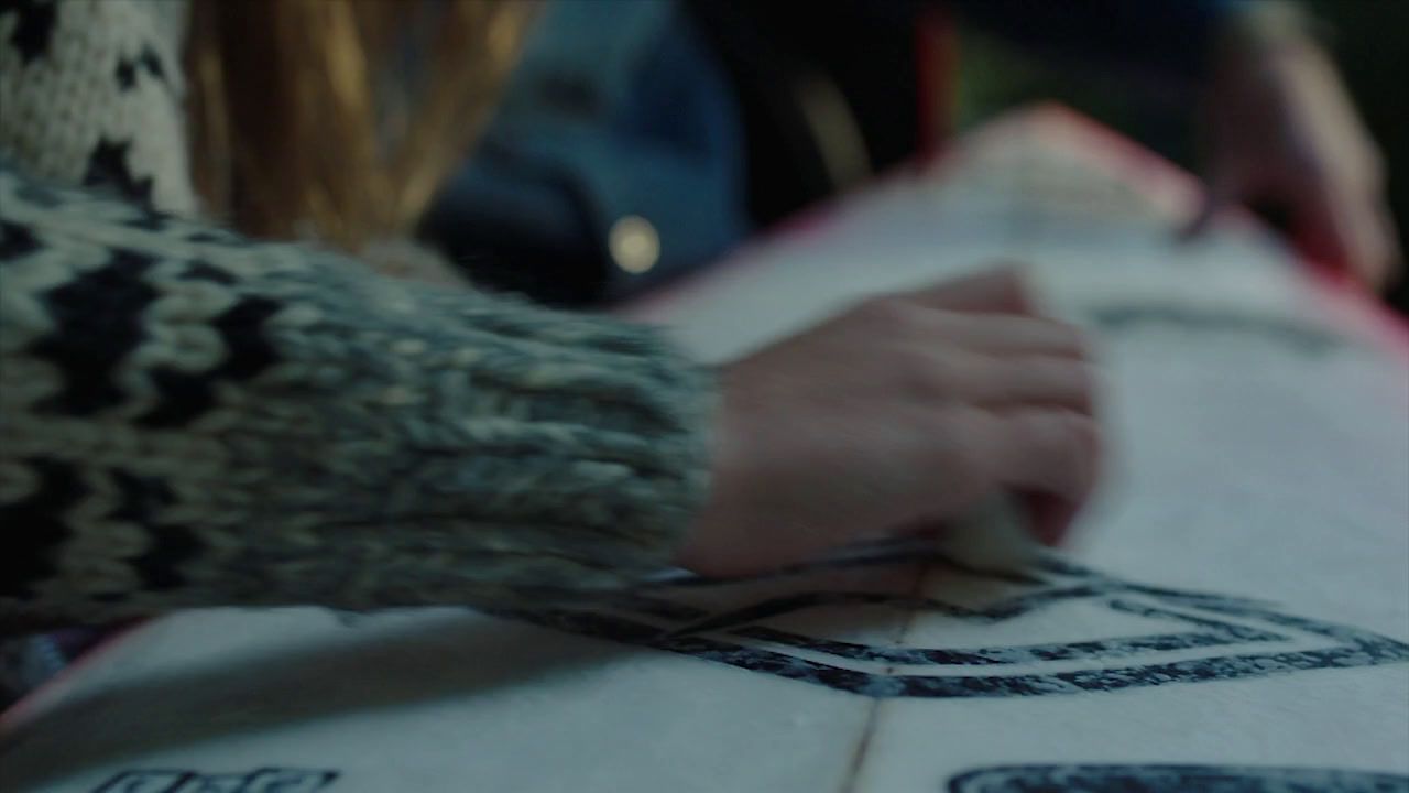 a close up of a person holding a surfboard